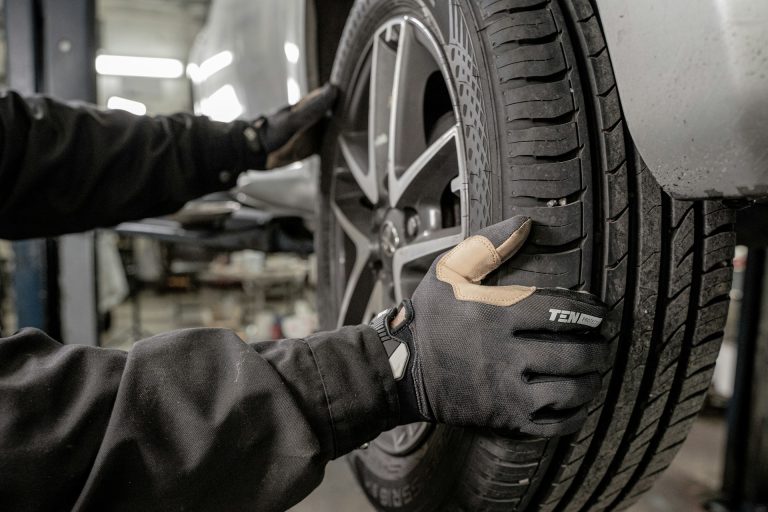 Mechanic Checking Tyre in Garage Testing MOT